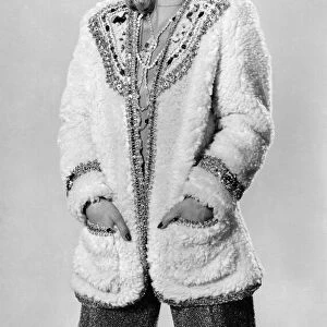 Model Sharron Lynne wearing fluffy cardigan, hands in pockets