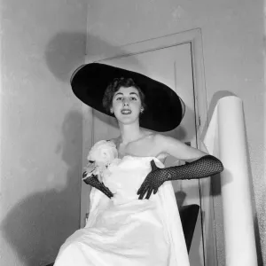 Model Shirley Galley, Miss Velvet'seen here having her dress fitted by