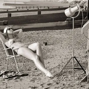 A model sunbathing under a UV lamp on the beach at Cleethorpes November 1967 A model sunbathing under a UV lamp on the beach at Cleethorpes November 1967