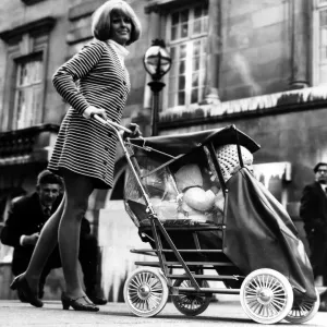 Model Susie Bell, age 27 of Putney, demonstrates the new baby-tendem on 30th September Model Susie Bell, age 27 of Putney, demonstrates the new baby-tendem on 30th September