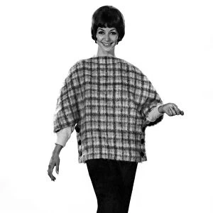 Model Valerie Gaten wearing patterned top with trousers. October 1961 P008804
