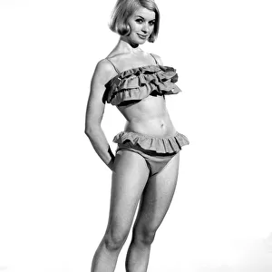 Model Vyoyan Dunbar wearing a frilly bikini outfit. July 1965 P009023