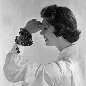Model wearing wrist jewellery, July 1955