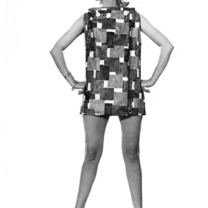 Model Wendy Tripp wearing sleeveless patterned mini dress