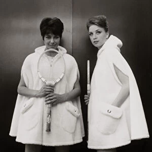 Models Sandra Russell (left) and Judy Wilson showing a zip-up hooded cape in fur fabric