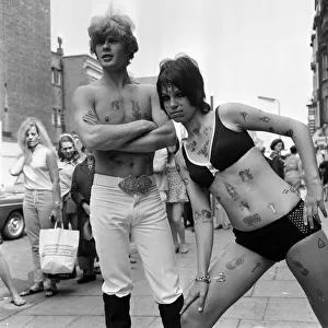 Models wearing tattoo transfers. 1967