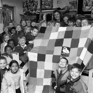 Moldgreen Junior and Infants School pulls with their knitted blanket