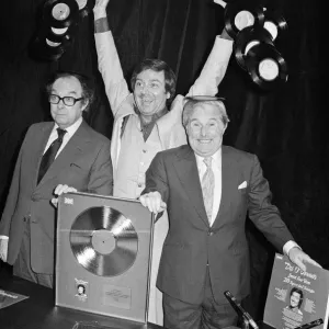 Morecambe and Wise present Des O Connor with a golden disc to mark 100000 sales of Morecambe and Wise present Des O Connor with a golden disc to mark 100000 sales of
