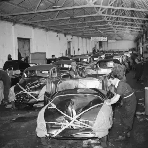 Morris Minor Low Light Sedans fresh of the production line being packed for export Morris Minor Low Light Sedans fresh of the production line being packed for export
