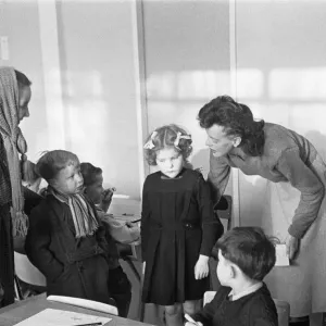 A mother drops off her son at his new school, South Mead School, Southfield, Wimbledon A mother drops off her son at his new school, South Mead School, Southfield, Wimbledon
