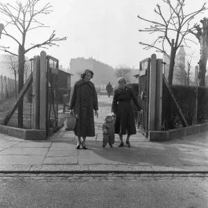 Mother, Grandmother and child seen here walking in an un-named East London Park