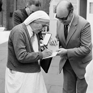 Mother Teresa of Calcutta seen here signing autographs outside St James Church Piccadilly