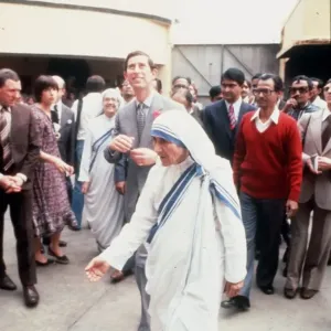 Mother Theresa walking in the street in India with Prince Charles Mother Theresa walking in the street in India with Prince Charles