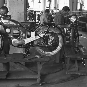 Motorcycles being assembled on the production line at the Bianchi factory in Milan Motorcycles being assembled on the production line at the Bianchi factory in Milan