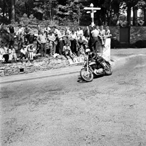 Motorsport. Isle of Man TT Races 1953 E. B. Crooks rounding Govenors Bridge in
