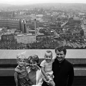 Black and white photograph print of a family in their flat