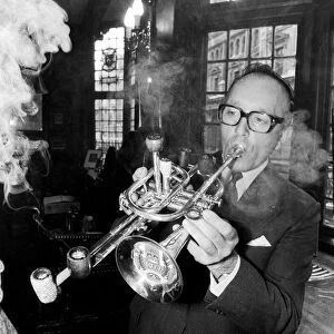 Mr Brian Cole winner of the Remarkable Pipe Contest seen here smoking / playing his