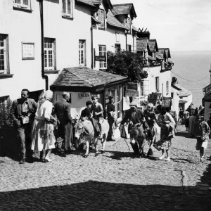Mr Gulliver (left) takes a party of elderly people from the harbour of Clovelly, Devon Mr Gulliver (left) takes a party of elderly people from the harbour of Clovelly, Devon