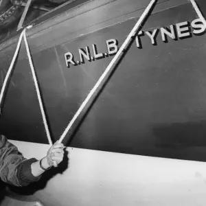 Mr. Jack Watson, a permanent RNLI mechanic, with the Tynesider lifeboat Mr. Jack Watson, a permanent RNLI mechanic, with the Tynesider lifeboat