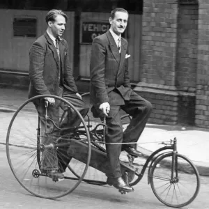 Print of Mr James Goodwin on a Singer Tandem Tricycle from 1880 Print of Mr James Goodwin on a Singer Tandem Tricycle from 1880