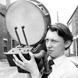Mr. John Heslop with part of the percussion fitments that form part of a pre-war theatre