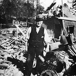 Mr McGregor stands amidst the debris of his house, following a Baedeker Raid on York
