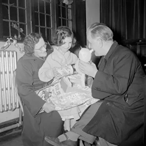 Mr and Mrs O Hara seen here giving present to one of the Children at the St Agnes
