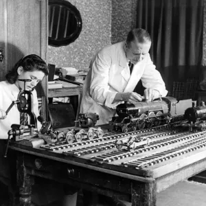 Mr. R. Lennard works on a scale model of an LNER Pacific Loco with help from his daughter Mr. R. Lennard works on a scale model of an LNER Pacific Loco with help from his daughter