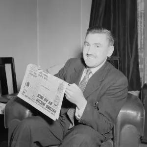 Mr Robert Hope seen here at home reading the Daily Mirror