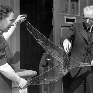 Mr. W. Fraser, stores manager at Irvins North Shields with a moedl trawl net in 1949 Mr. W. Fraser, stores manager at Irvins North Shields with a moedl trawl net in 1949