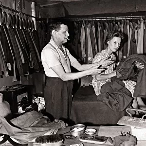 Mr. W. P. Worthy and his wife iron clothes for American troops in the West Country village