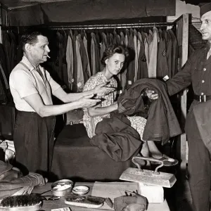Mr. W. P. Worthy and his wife iron clothes for American troops in the West Country village Mr. W. P. Worthy and his wife iron clothes for American troops in the West Country village