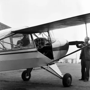 Mrs Diana Freeman from Headcorn, Kent explains the controls of her Auster aircraft wile Mrs Diana Freeman from Headcorn, Kent explains the controls of her Auster aircraft wile