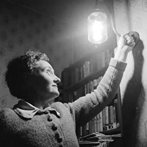Mrs Dorothy Mead who still lights her house with gas lamps Circa 1958