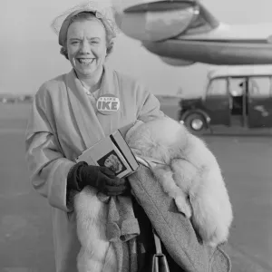 Mrs Eric Burt just stepping of the BOAC flight from the USA wearing