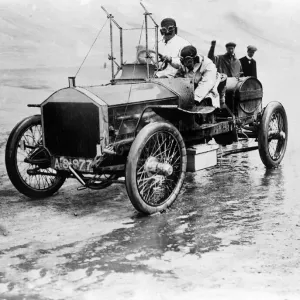 Mrs F Edge seen here stopping for petrol and to change wheels during motor trials circa
