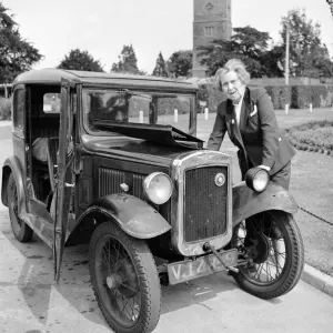 Mrs Goul looks under the bonnet of her car following a breakdown on the village green Mrs Goul looks under the bonnet of her car following a breakdown on the village green