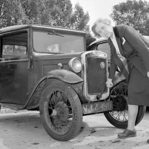 Mrs Goul Starts Car with Handle Print Circa 1957 Mrs Goul Starts Car with Handle Print Circa 1957