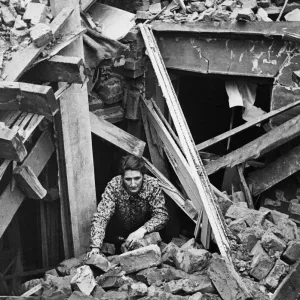 Mrs. J. Owen, mother of seven (4 evacuated) has lost two homes from bombs Mrs. J. Owen, mother of seven (4 evacuated) has lost two homes from bombs