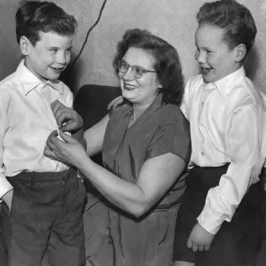 Mrs. Mary Smalley of Burley, Lancs, with her two sons, Terry (aged 6) on the left Mrs. Mary Smalley of Burley, Lancs, with her two sons, Terry (aged 6) on the left