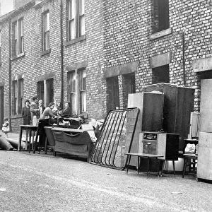 Mrs. McGeorges furniture stands outside her home in John Street