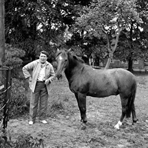 Mrs. Moss seen here with her horses. 1954 A145d