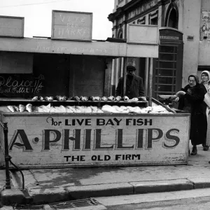 Mrs Phillips serving customers at her stall in Princes Street, Bridnlington