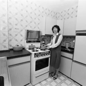 Mrs Singleton of Croydon has had her kitchen done up by a new cheap method that entails Mrs Singleton of Croydon has had her kitchen done up by a new cheap method that entails