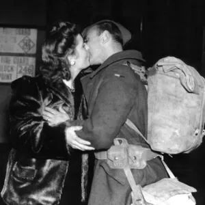 Mrs Wells of Leigh On Sea greets her husband with a kiss at the railway station after Mrs Wells of Leigh On Sea greets her husband with a kiss at the railway station after