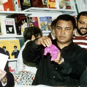 Muhammad Ali (Cassius Clay) former boxing champion does tricks to entertain the crowd Muhammad Ali (Cassius Clay) former boxing champion does tricks to entertain the crowd