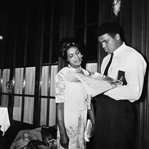 Muhammad Ali (Cassius Clay) with a female fan. Ali is in London for of his rematch