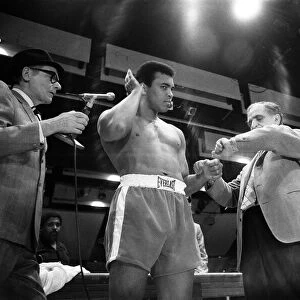 Muhammad Ali clowns around for the cameras leading up to his first fight with Joe