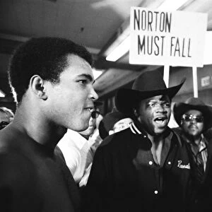 Muhammad Ali faces his upcoming opponent Ken Norton at the the medical examination at