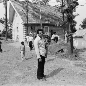 Muhammad Ali with fans at his training camp in Pennsylvania. 27th August 1974